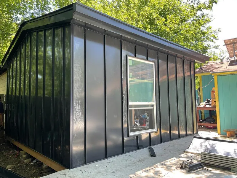 Black standing seam metal wall panels for Roof Inspection in Munster